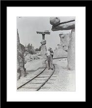 Load image into Gallery viewer, "Walt Walking on the Tracks of Rainbow Caverns Mine Train" from Disney Photo Archives