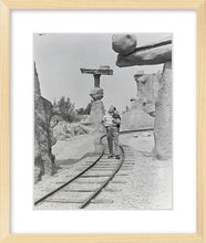 Load image into Gallery viewer, "Walt Walking on the Tracks of Rainbow Caverns Mine Train" from Disney Photo Archives