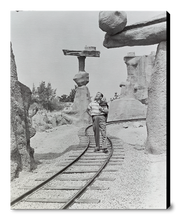 Load image into Gallery viewer, "Walt Walking on the Tracks of Rainbow Caverns Mine Train" from Disney Photo Archives