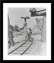 Load image into Gallery viewer, "Walt Walking on the Tracks of Rainbow Caverns Mine Train" from Disney Photo Archives