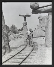 Load image into Gallery viewer, "Walt Walking on the Tracks of Rainbow Caverns Mine Train" from Disney Photo Archives