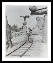Load image into Gallery viewer, "Walt Walking on the Tracks of Rainbow Caverns Mine Train" from Disney Photo Archives