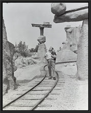 Load image into Gallery viewer, "Walt Walking on the Tracks of Rainbow Caverns Mine Train" from Disney Photo Archives