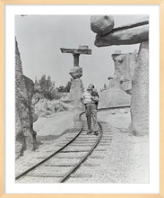 Load image into Gallery viewer, "Walt Walking on the Tracks of Rainbow Caverns Mine Train" from Disney Photo Archives