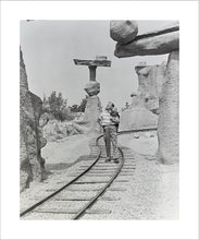 Load image into Gallery viewer, "Walt Walking on the Tracks of Rainbow Caverns Mine Train" from Disney Photo Archives