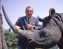 Load image into Gallery viewer, Publicity still of Walt Disney and a rhinoceros in the Jungle Cruise at Disneyland Park