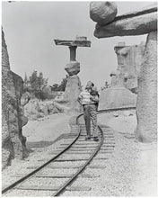 Load image into Gallery viewer, "Walt Walking on the Tracks of Rainbow Caverns Mine Train" from Disney Photo Archives