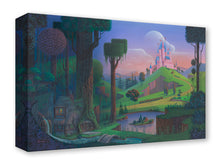 Load image into Gallery viewer, Sleeping Beauty's pink castle glows on a green hill above a forest cottage and pond at dusk.